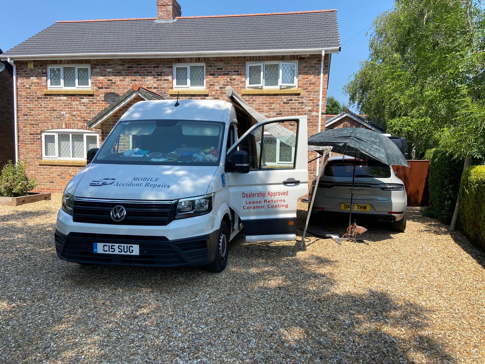 Mobile Accident Repairs Ltd service van at customer property for alloy wheel and dent repair in Manchester