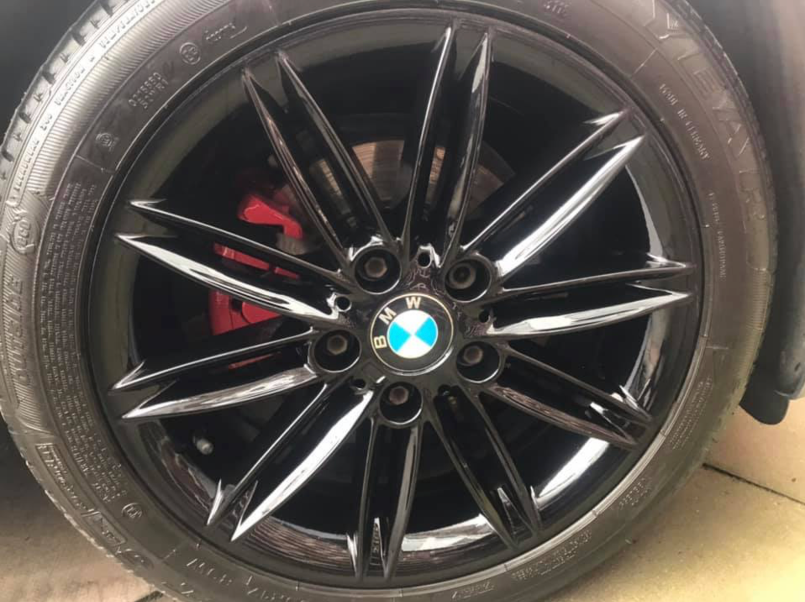 Black BMW alloy wheel refurbished by Mobile Accident Repairs Ltd Manchester